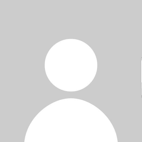 Generic white silhouette of a person's head and shoulders against a solid gray background.